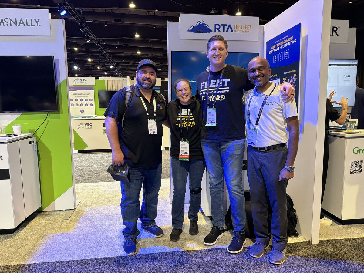Ganes Kesari with three members of the RTA team at their exhibition stand