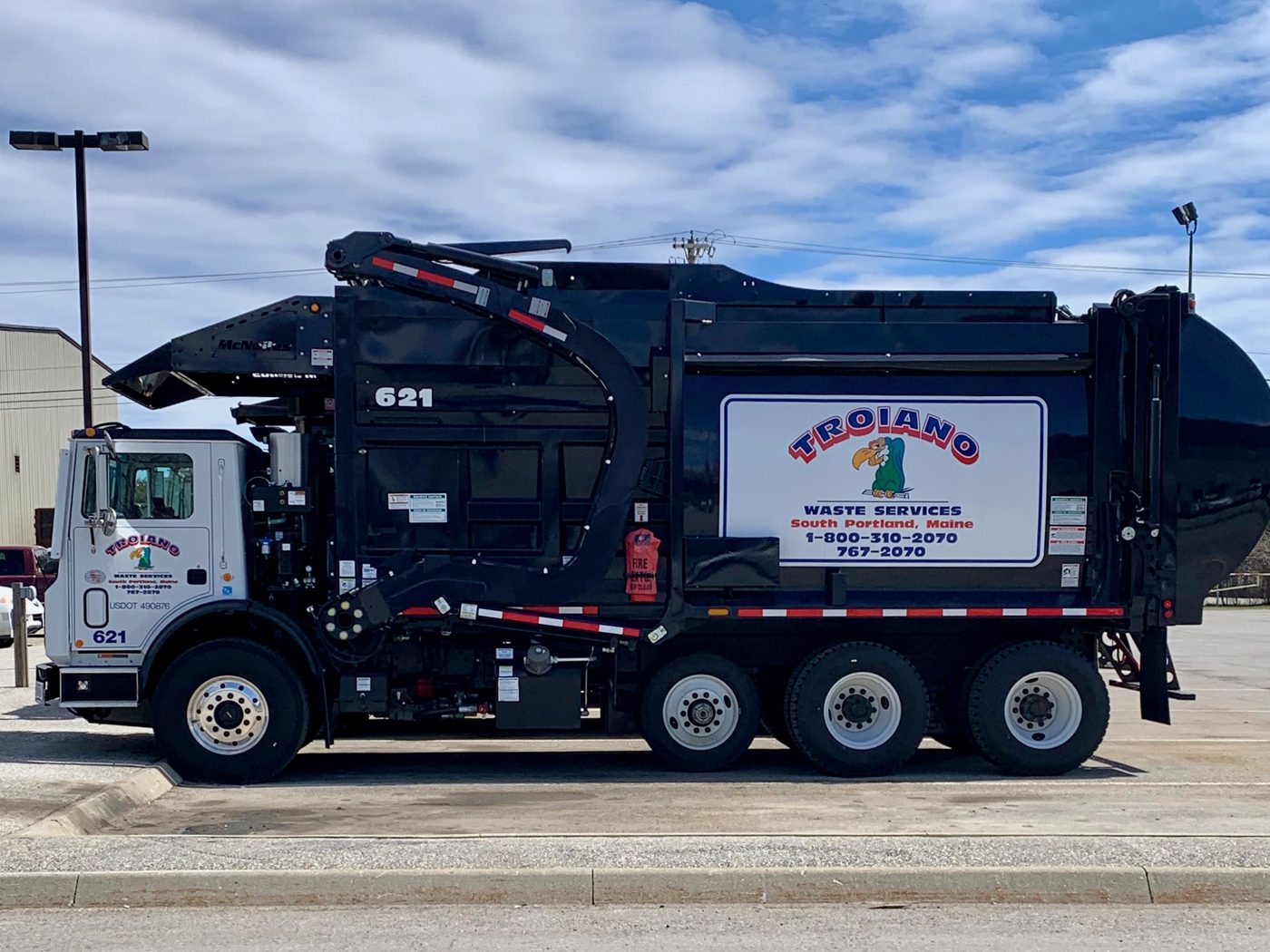 A Troiano Waste Services front loader parked at the yard